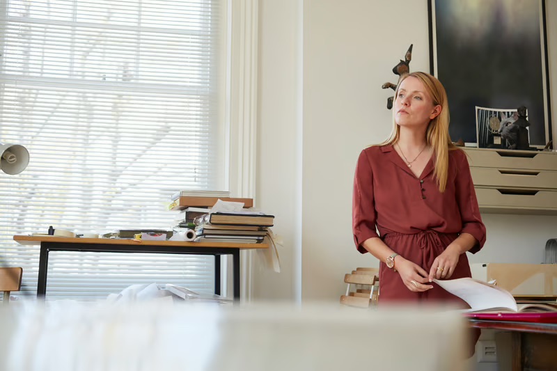 Female business owner reflecting on leadership decisions while building a purpose-driven healthcare business rooted in faith, resilience, and service.